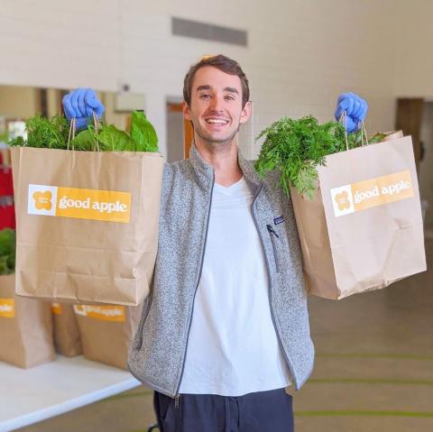 Zack holding bags