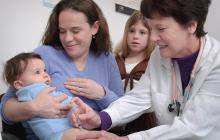 A pediatrician gives a baby a shot at an office visit. Credit: CDC, Unpslash