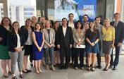 Students pose with former HUD Secretary Julian Castro (center) and Dr. Michael Hole (right)