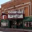 Theater marquee reading "Temporarily closed to due to corona." Credit: Tom Barrett, Unsplash
