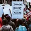Sign at a protest reading "action." Credit: Natalie Chaney, Unsplash
